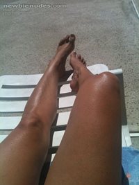 Feet and legs by the pool