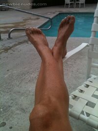 Legs and feet by the pool
