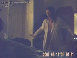 Voyeur full frontal of the wife as she unknowingly takes off her bathrobe. ...