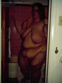 in bathroom standing nude