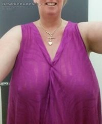 trying on a new top in changing room