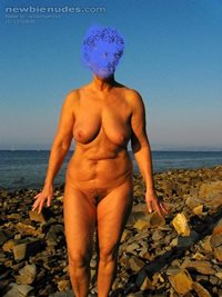 Mature woman on the beach, would anyone join and play with her hard tits an...