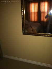 After taking off my clothes, my neighbor uses my iphone to take my photos a...